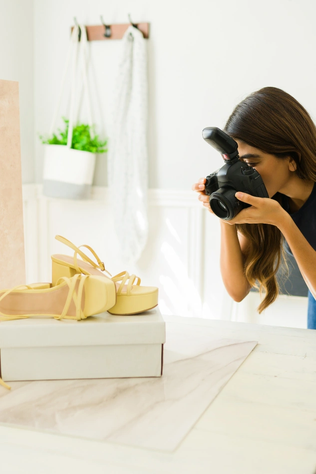Freelance photographer capturing drink product in studio