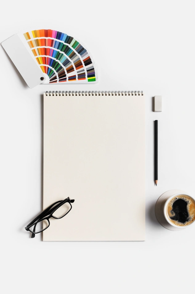Business branding photography tools like notebooks and color palettes ready to define your visual identity with clarity and creativity.