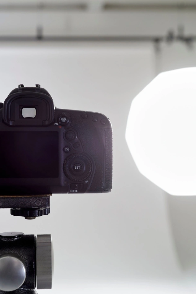 DSLR camera and lighting setup in a professional studio, ideal for creating high-quality visual content and promotional media.
