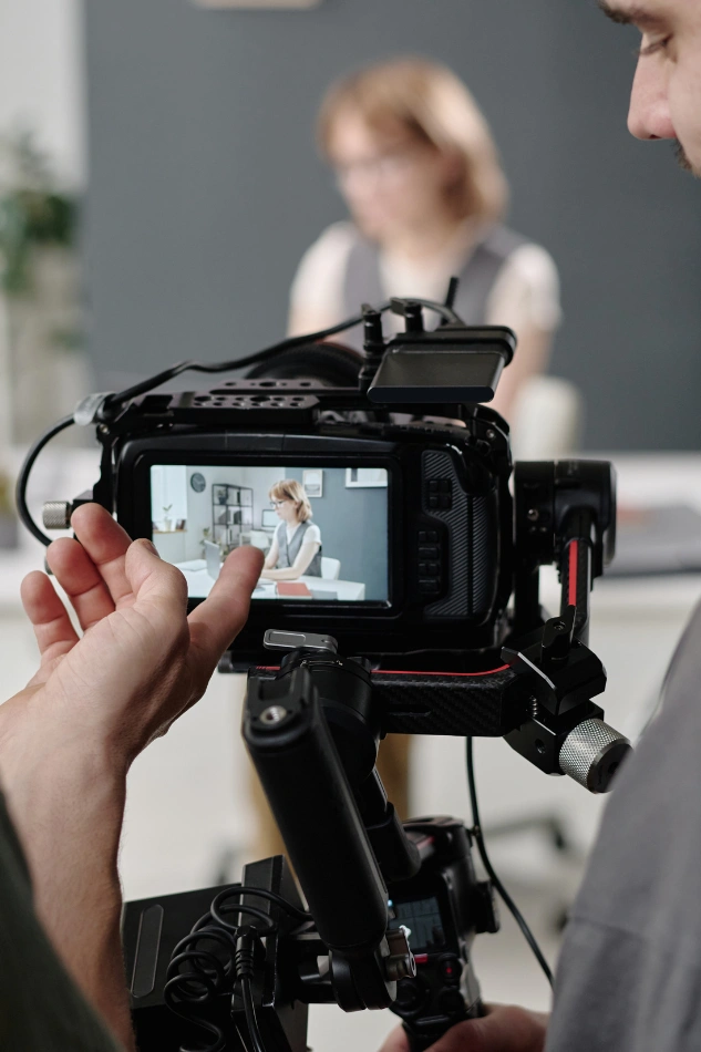 wedding videography behind the scenes with bride on screen