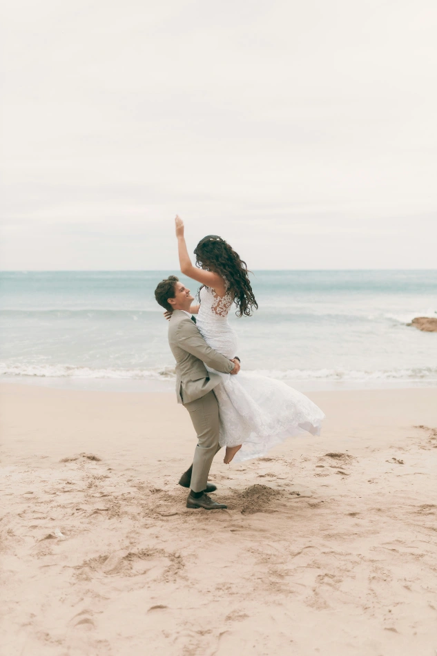 Bride and groom at beach wedding – questions to ask your wedding photographer before the big day